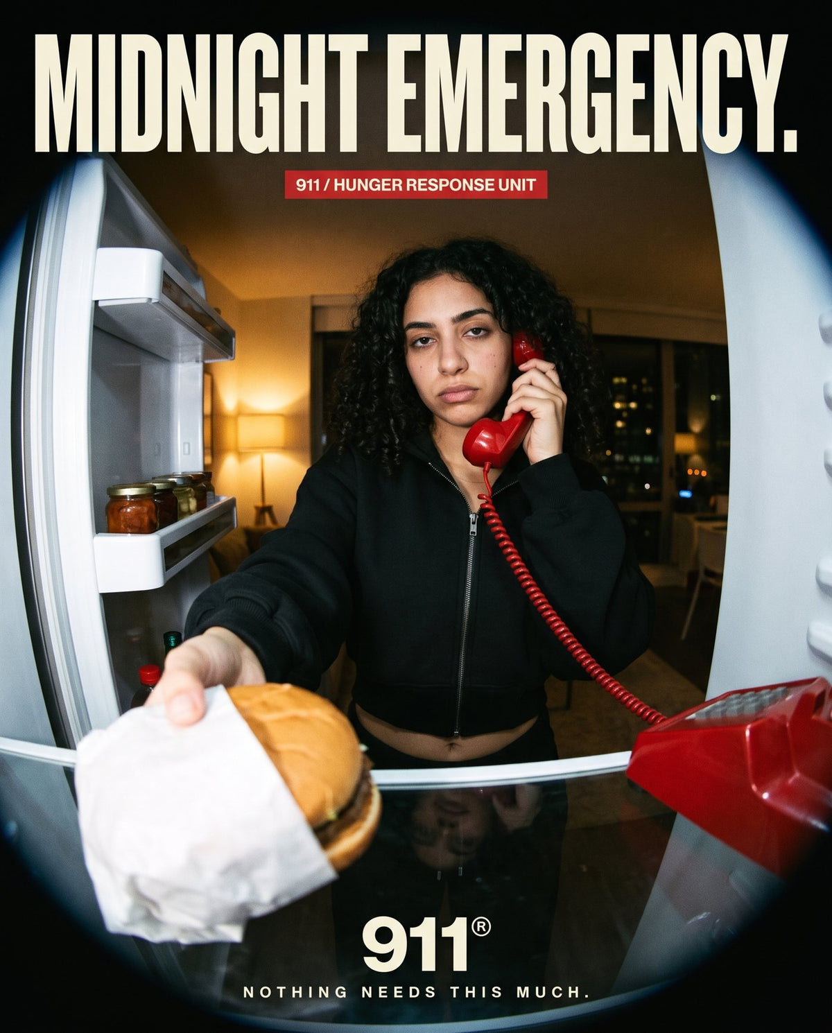 Midnight emergency: model in the black 911 fleece set reaching into the fridge